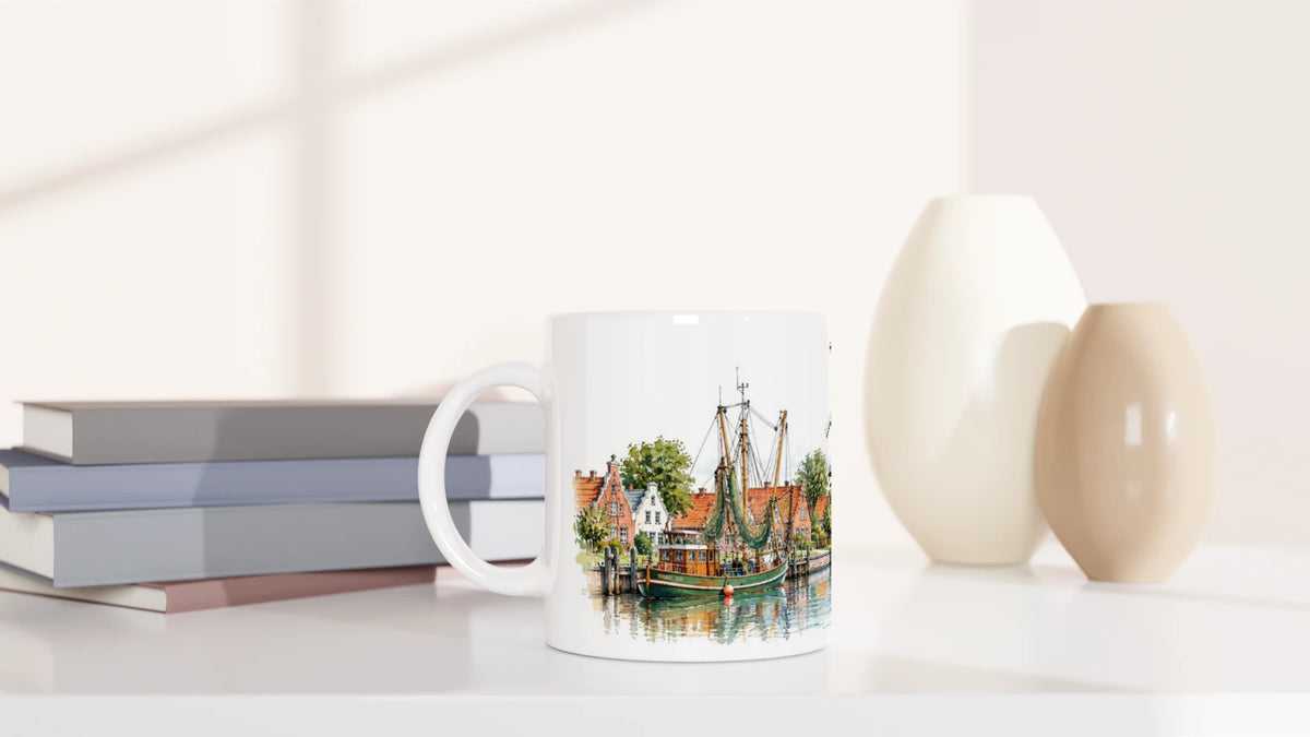 Die beiden Greetsieler Zwillingsmühlen als detailreiche Aquarellillustration mit großen Mühlenflügeln, rotem Mauerwerk und grüner ostfriesischer Landschaft