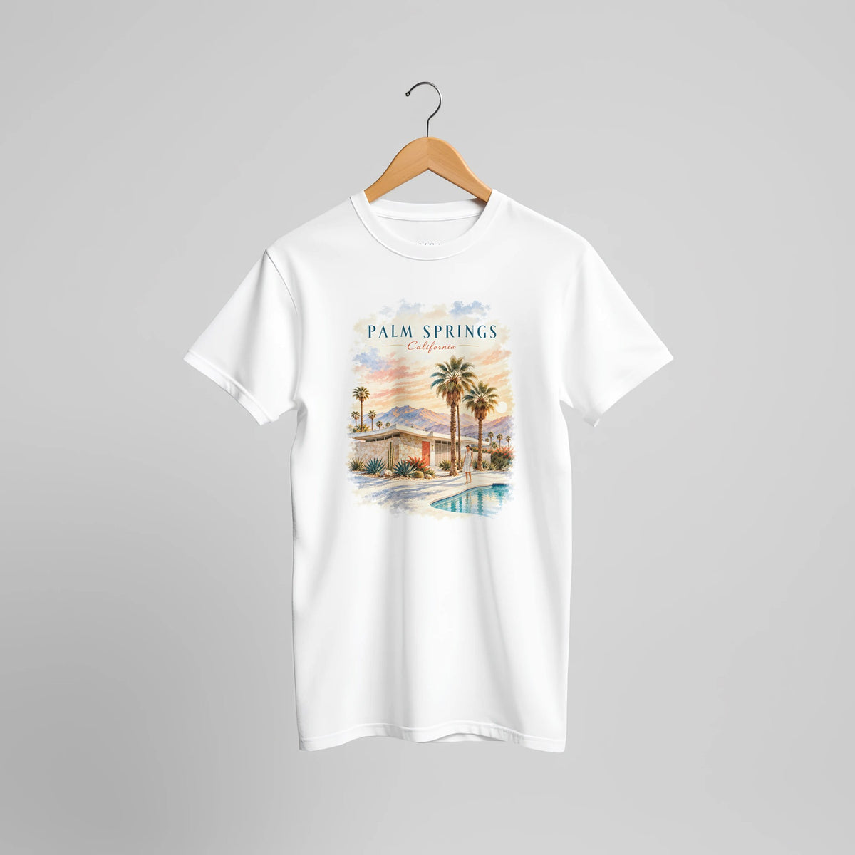 Grafisches T-Shirt-Motiv mit Pool und Palmen, inspiriert vom sonnigen Palm Springs in Kalifornien. Ein lässiger Retro-Look für Urlaubserinnerungen und den Alltag.