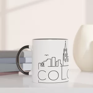 Skyline Köln Tasse 330 ml aus Keramik in Weiß mit schwarzem Innenbereich und schwarzem Henkel, minimalistisches Line-Art-Motiv mit Kölner Dom und Stadtsilhouette